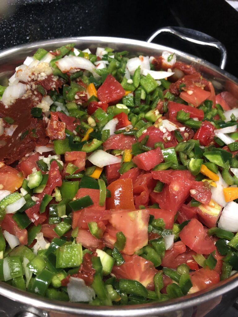 Fresh chopped vegetables in pot for cooking.