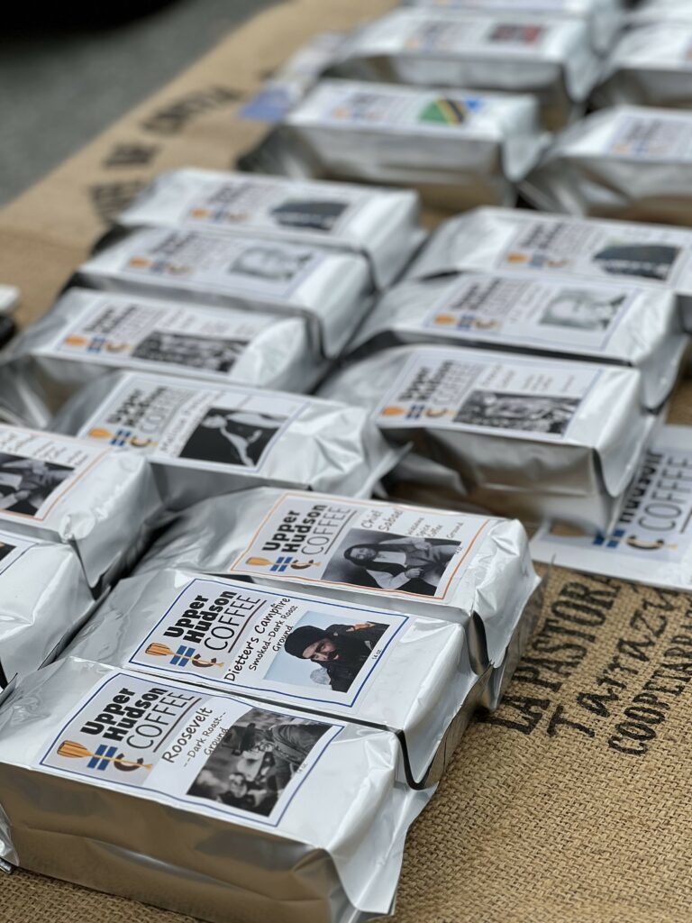 Packaged coffee bags on display with labels.