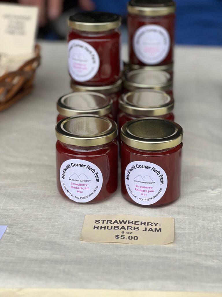 Jars of strawberry-rhubarb jam for sale.