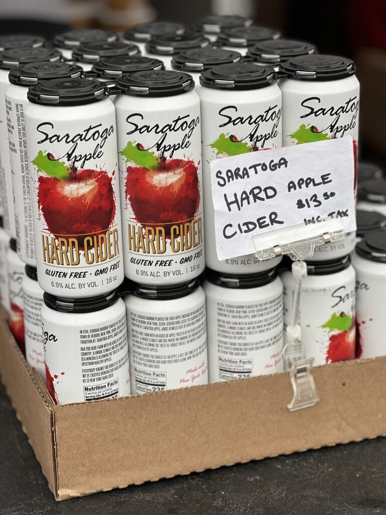Saratoga hard apple cider cans on display for sale.