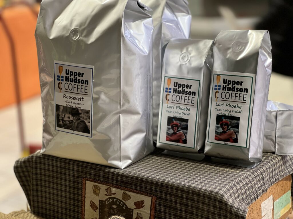 Three Upper Hudson Coffee bags, dark roast, decaf varieties.