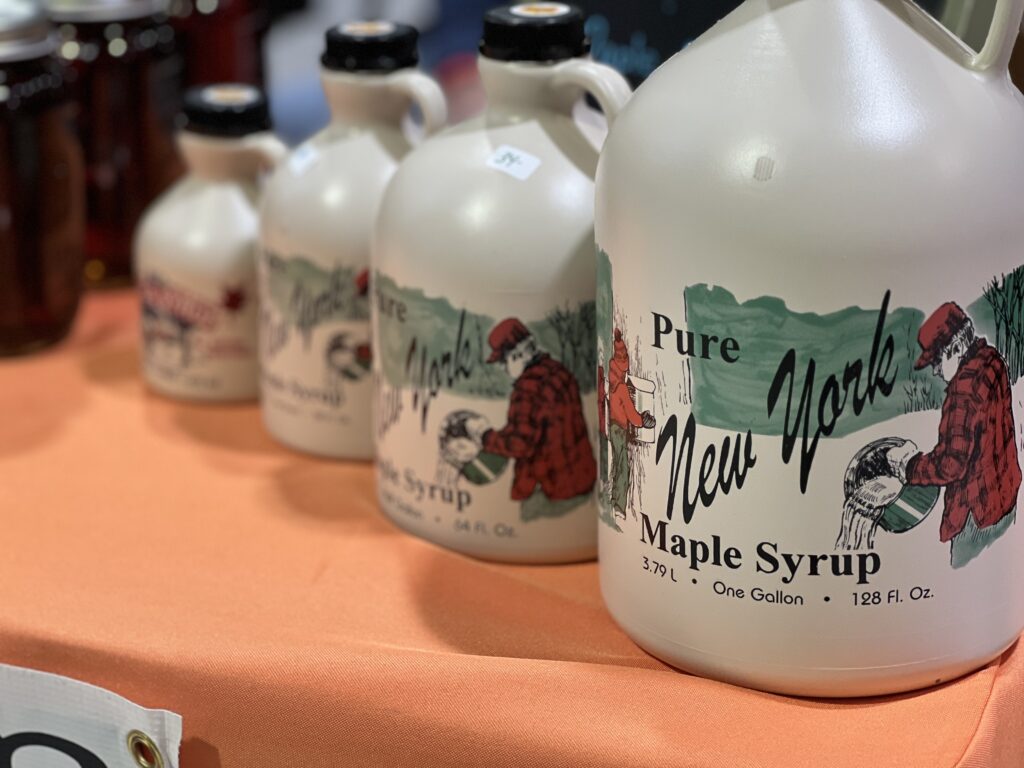 Gallon jugs of pure New York maple syrup.