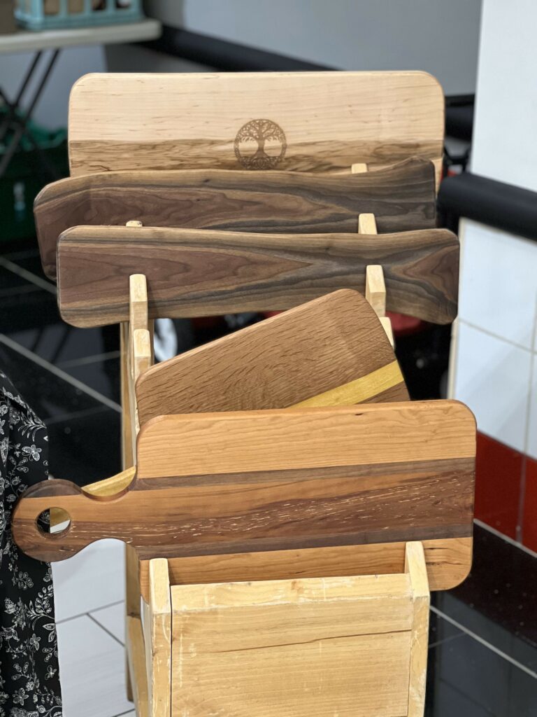 Assorted wooden cutting boards on display.
