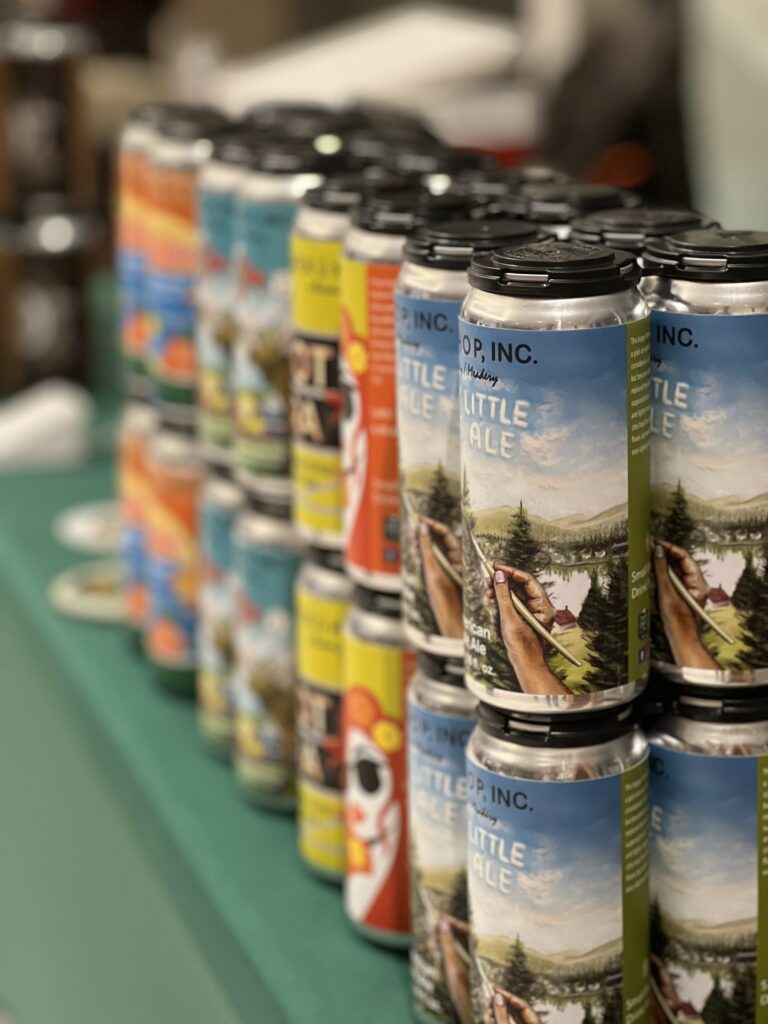 Row of assorted craft beer cans.