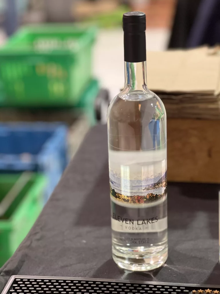 Bottle of Eleven Lakes Vodka on table.