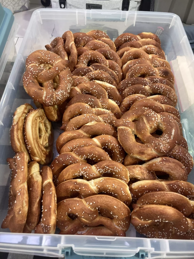 Fresh baked soft pretzels in container.
