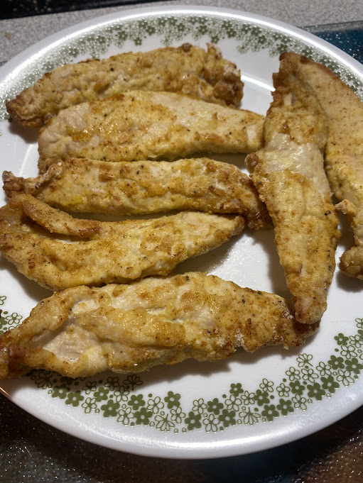 Plate of fried fish fillets.