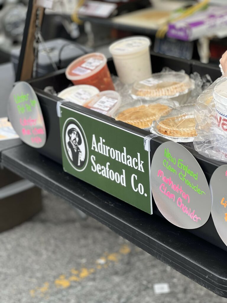 Adirondack Seafood Co. stand with clam chowder varieties.