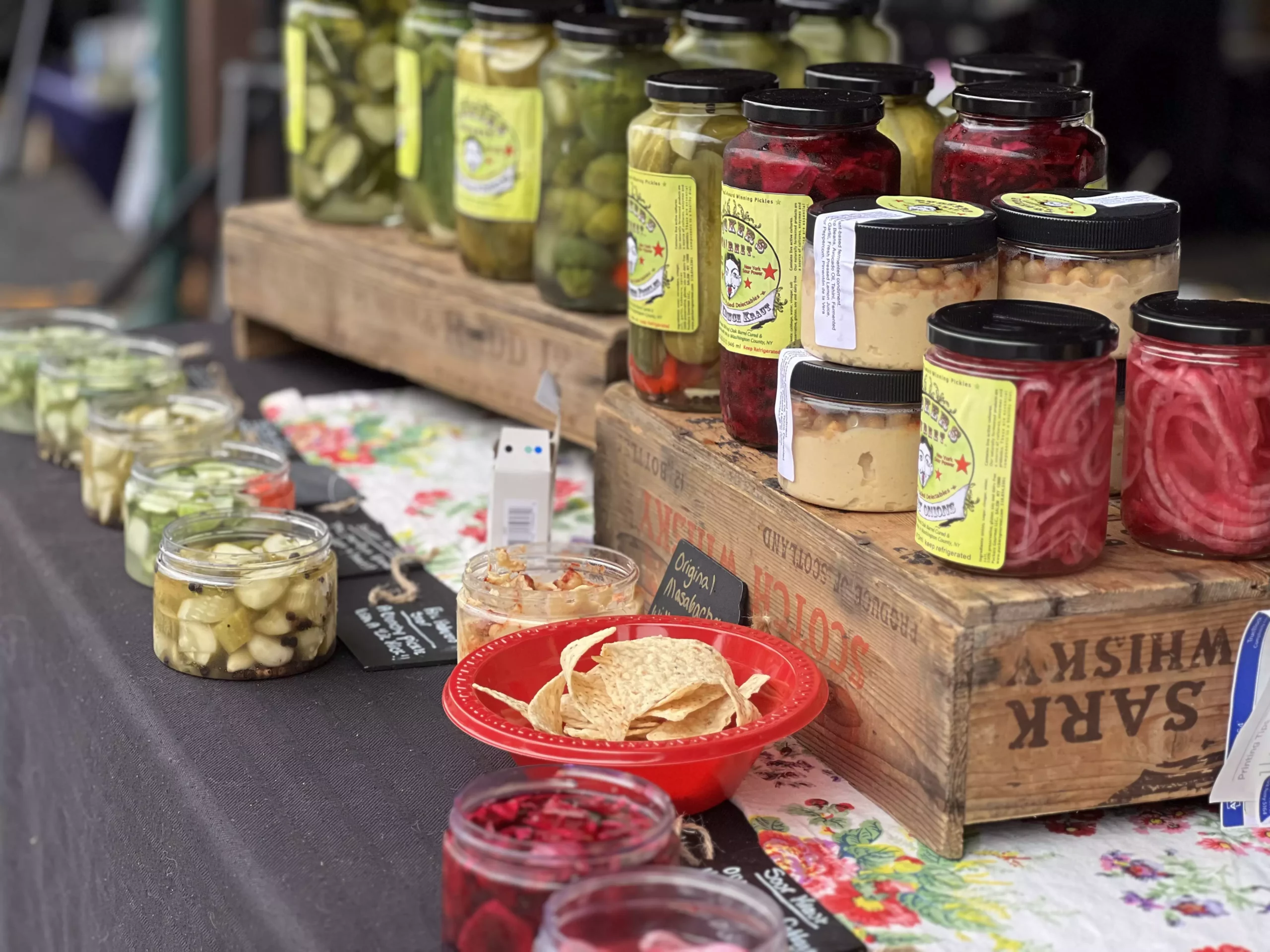 Assorted pickled goods displayed at a market stall.