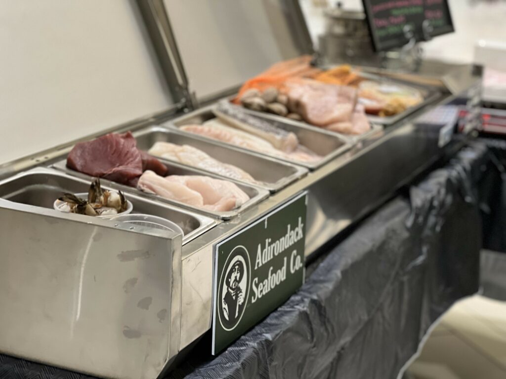 Fresh seafood display at market counter.