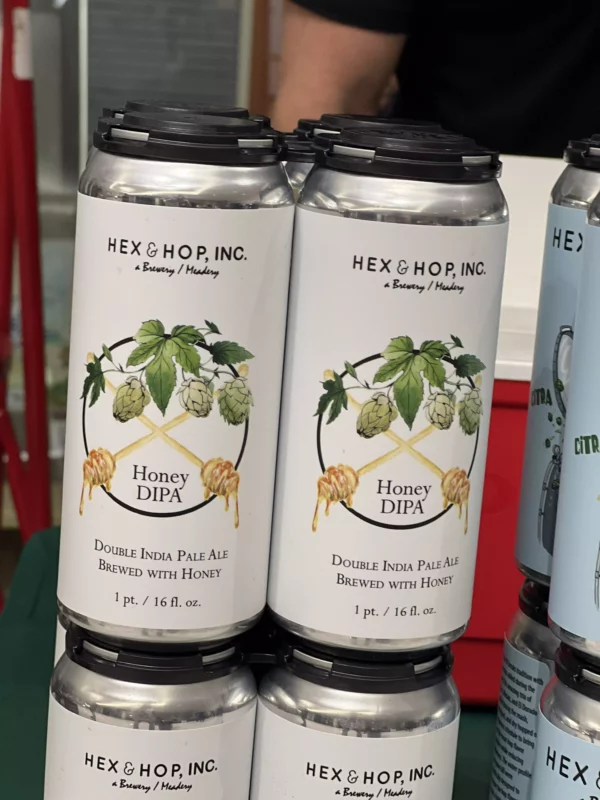 Hex & Hop Honey DIPA craft beer cans.