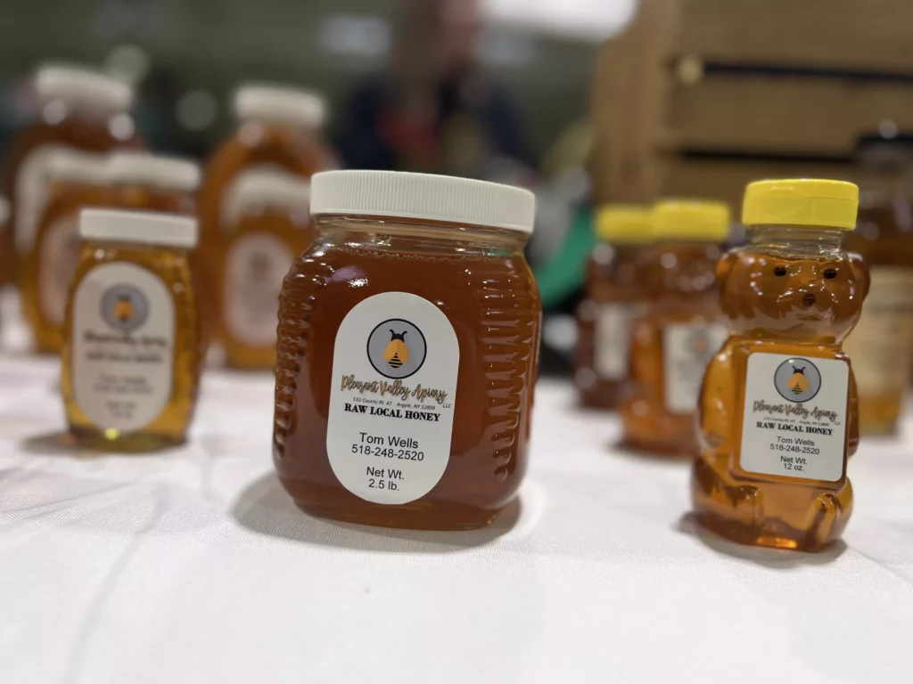 Local honey jars on display for sale.
