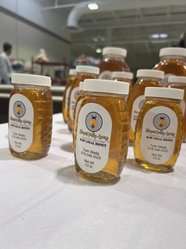 Jars of raw local honey on display.