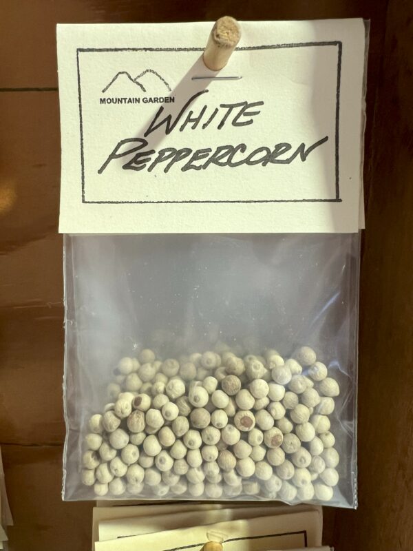 Bag of white peppercorns with label.