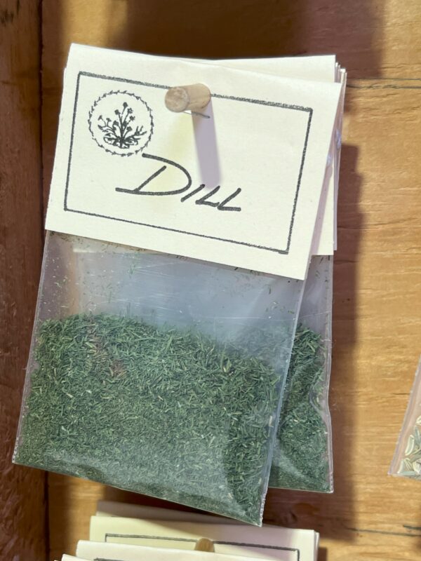 Dried dill herb packet with labeled paper tag.